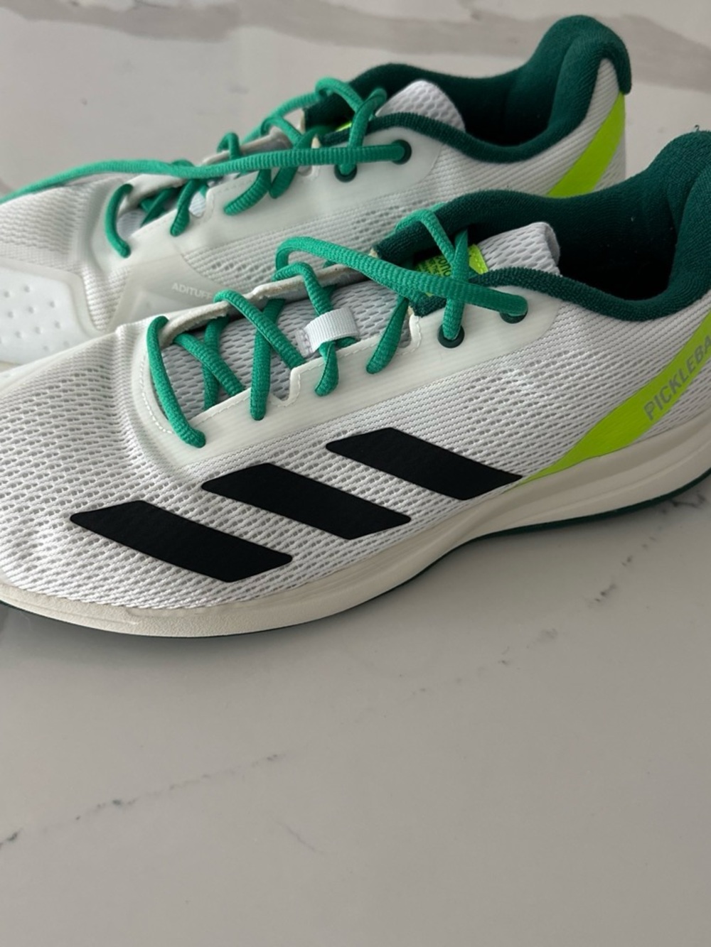 adidas White Athletic Shoes with Green and Black Accents